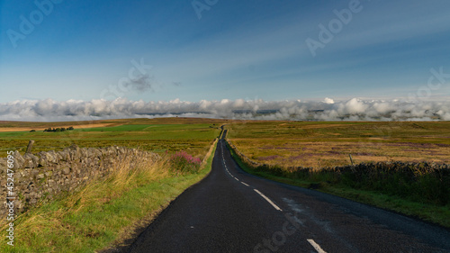 Road to Haltwhistle with clouds on horizon