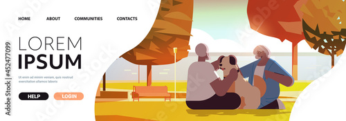 senior couple spending time with dog in urban park relaxation retirement concept full length
