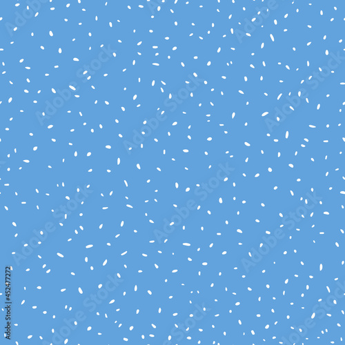 Small flying dots seamless repeat pattern. Random placed, vector round elements all over surface print on blue background.