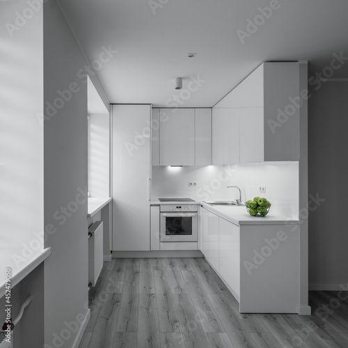 Wallpaper Mural Luxury studio apartment after renovation. Bright interior. Parquet floor. White kitchen set. Green apples. Torontodigital.ca