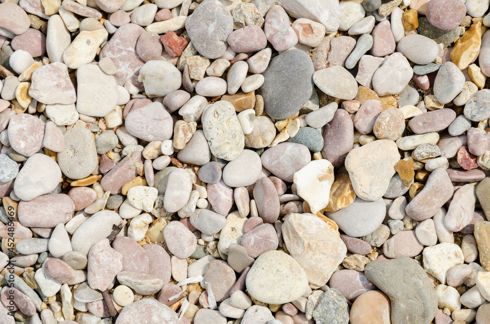 natural background multicolored dry sea pebbles on the seashore natural background multicolored dry sea pebbles on the seashore