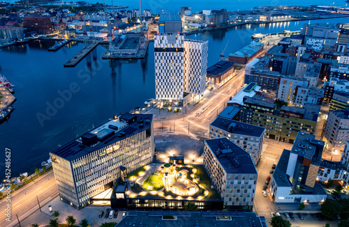 Aerial view of the Jatkasaari neighborhood is a brand new district in Helsinki. The modern buildings of hotels, offices, and residential buildings. The night cityscape.