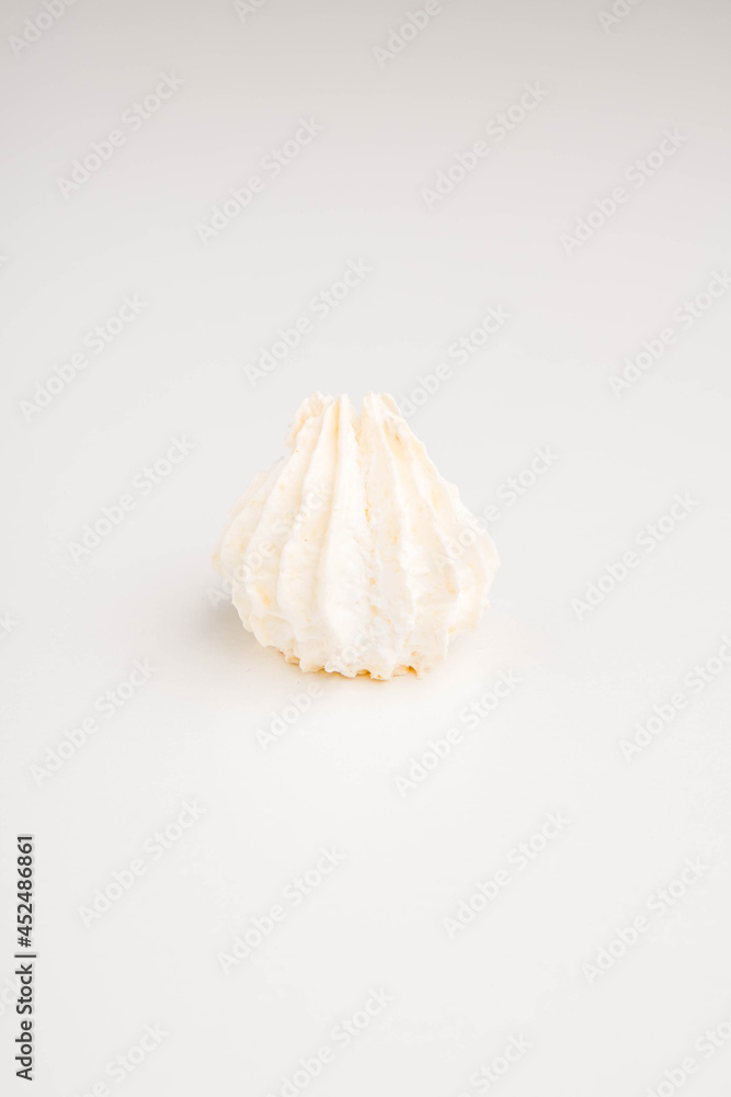 Airy meringue dessert on white background