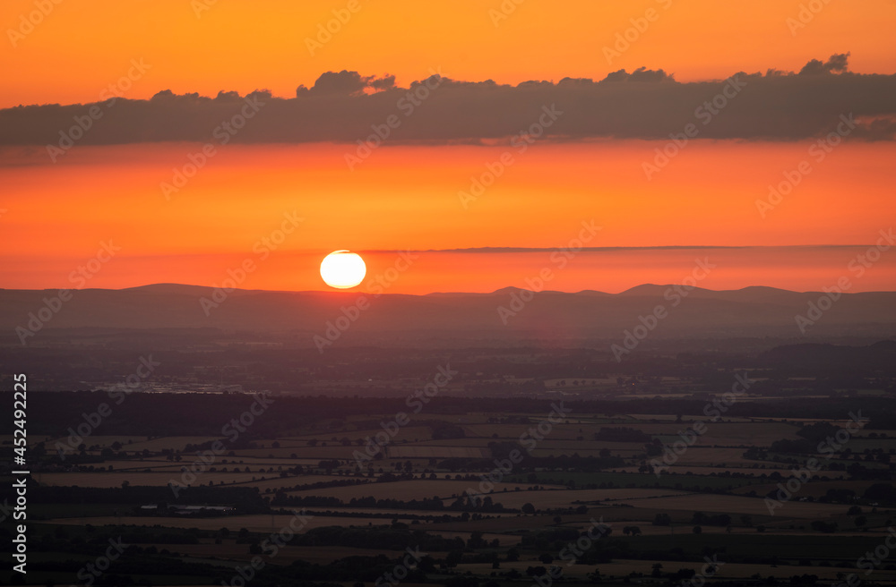 July sunset over the Shropshire Hills from the summit of the Wrekin near Telford West Midlands, England July sunset over the Shropshire Hills from the summit of the Wrekin near Telford West Midlands, England