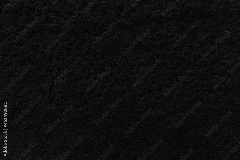 Dark grey black slate background or texture. Black granite slabs background. Dark grey black slate background or texture. Black granite slabs background.