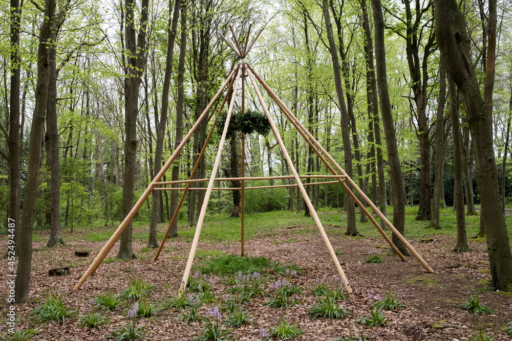 Wooden structure with wreath for a woodland naming ceremony. Wooden structure with wreath for a woodland naming ceremony.
