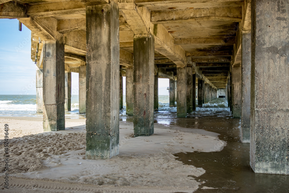 View near the sandy beach, under the concrete pier, Belgium