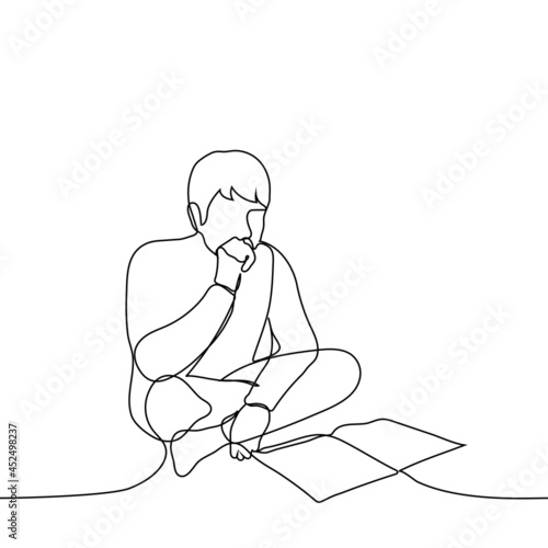 man is sitting on a bed or on the floor chatting a book (lectures) - one line drawing. concept student is preparing for the exam, applicant is preparing for admission, book lover is reading