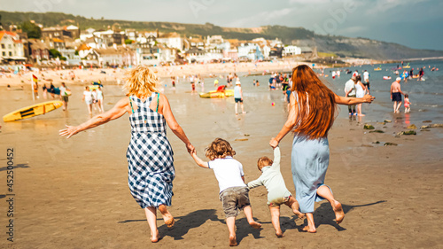 Multigenerational family is joyful and reunited during their summer holidyas in Lyme Regis, United Kingdom