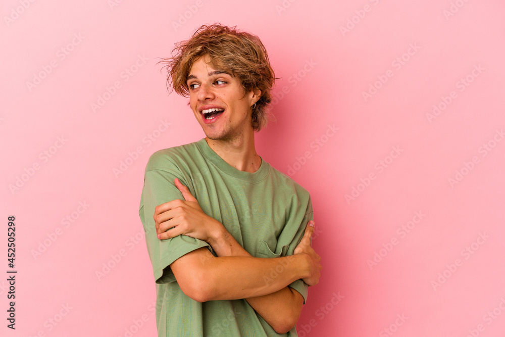 Young caucasian man with make up isolated on pink background smiling confident with crossed arms. Young caucasian man with make up isolated on pink background smiling confident with crossed arms.