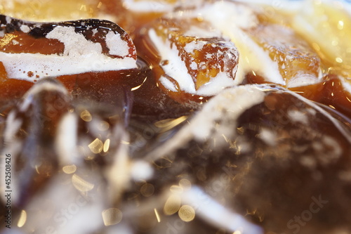 Close-up pictures of ice floating on Americano coffee.