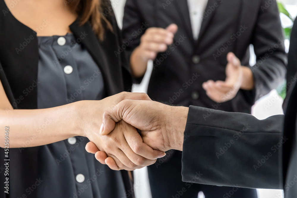 Obraz premium Partnership. business man investor team handshake deal with partner after finishing up business meeting on desk in meeting room office, financial, teamwork, contract agreement concept