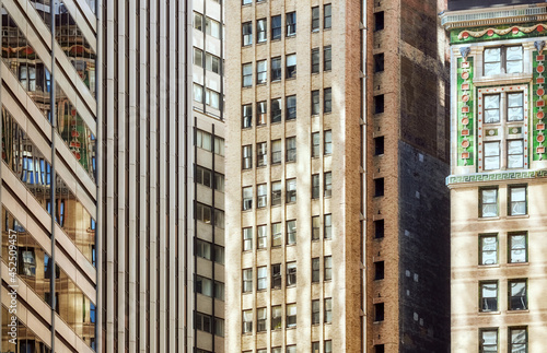 Close up picture of old buildings facades, Manhattan diverse architecture, New York City, USA.