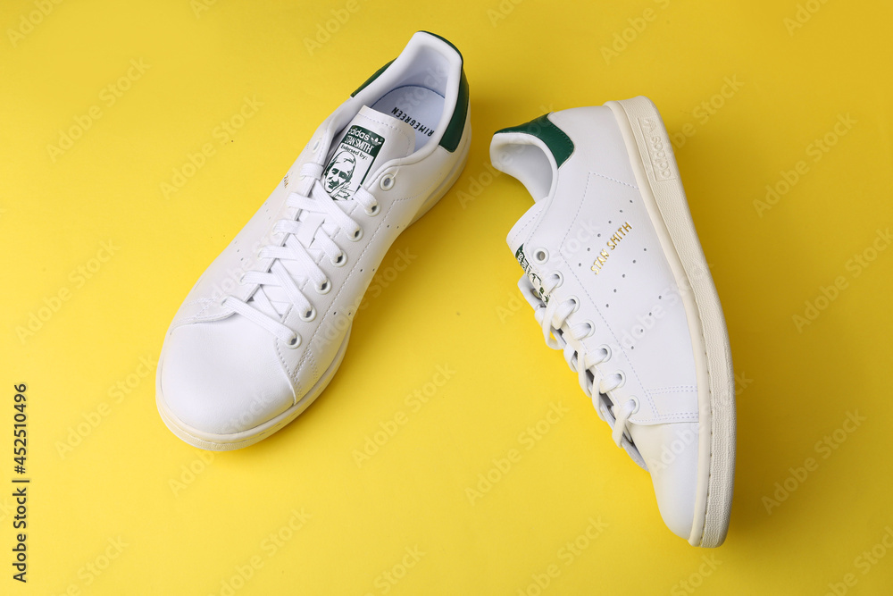 Jeddah Saudi Arabia August 21 2021 ADIDAS stan smith endorsed by shoes, on  yellow background. Product shot. Adidas is a German corporation that  designs and manufactures sports shoes Stock Photo | Adobe Stock