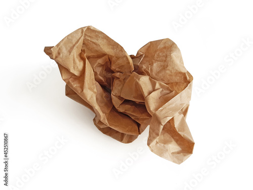 Piece of crumpled brown packing paper on white background. Aerial view of isolated kraft paper sheet. Protection and packaging material