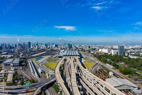 Bangkok skyline with new Bang Sue Grand Station in Bangkok, Thailand. Aerial view of Passenger and freight trains. Expressway top view