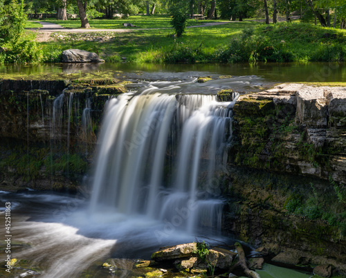 Fototapeta Naklejka Na Ścianę i Meble -  idyllic river landscape in the forest with a waterfall