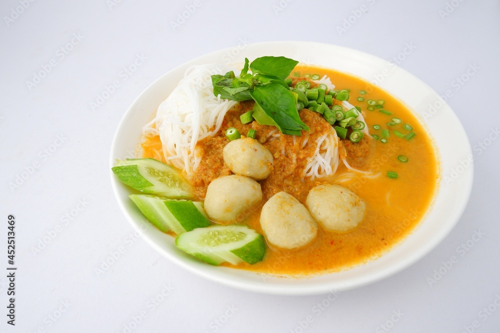 Food rice noodles with fish curry sauce on white dish on white background. Food rice noodles with fish curry sauce on white dish on white background.