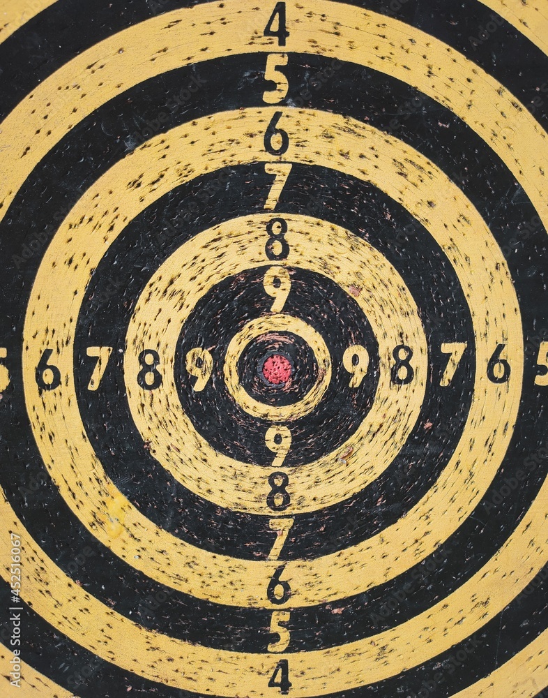 Red bullseye target or Used dart board target background. Concept of success for business targeting and winning goals. Red bullseye target or Used dart board target background. Concept of success for business targeting and winning goals.