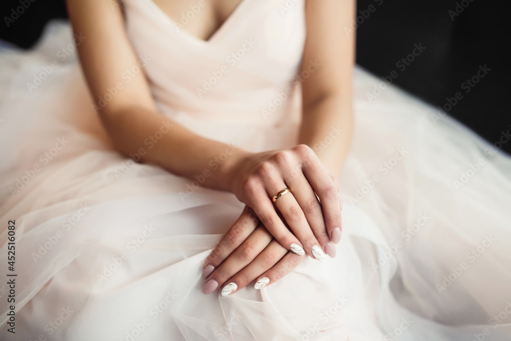 Engagement ring on a bride's fingers. Gentle hands of the bride. Wedding day. Engagement ring on a bride's fingers. Gentle hands of the bride. Wedding day.