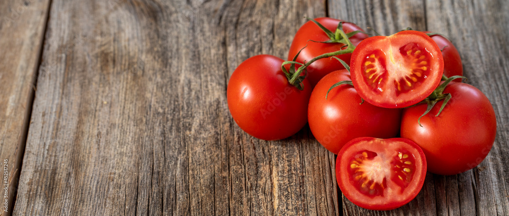 fresh ripe bunch tomatoes on wood background. Copy space fresh ripe bunch tomatoes on wood background. Copy space