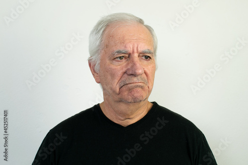 old male senior black shirt sad unhappy depression face expression frowning © kirill