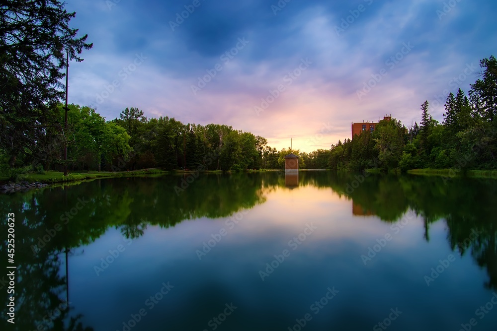 Sunrise Glowing Over A Summer Park Lake