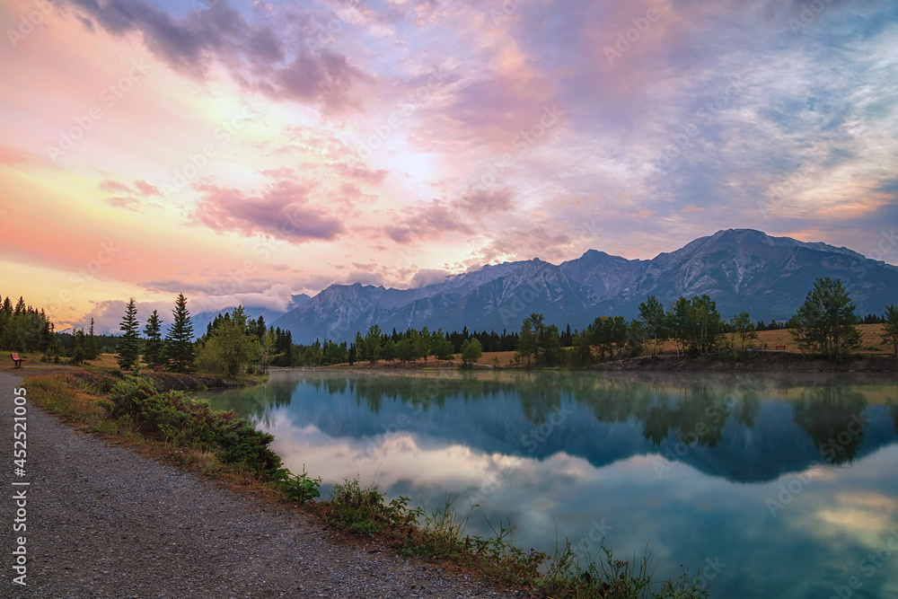 Sunrise Glow Over Canmore Mountains