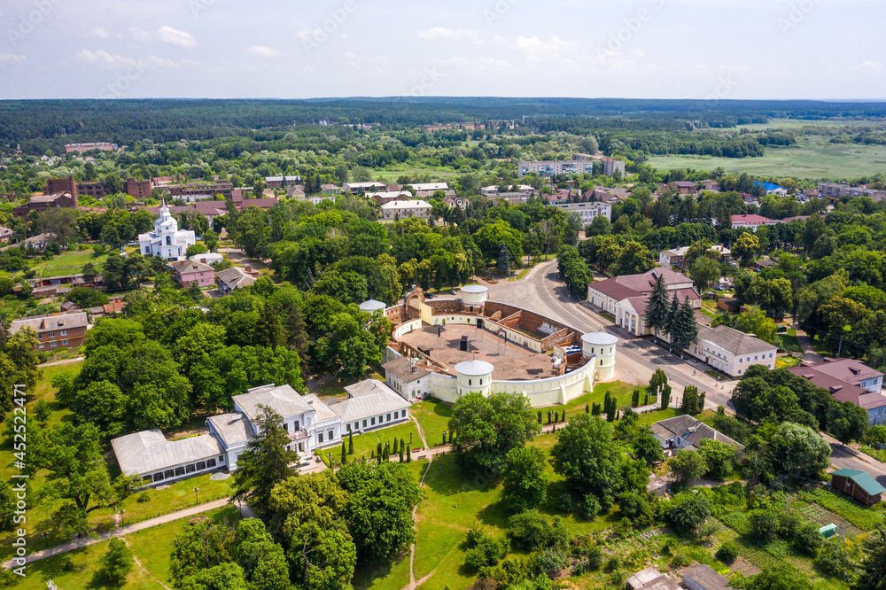 Round yard building against blue sky background. Galitzine palace in Trostyanets aerial view