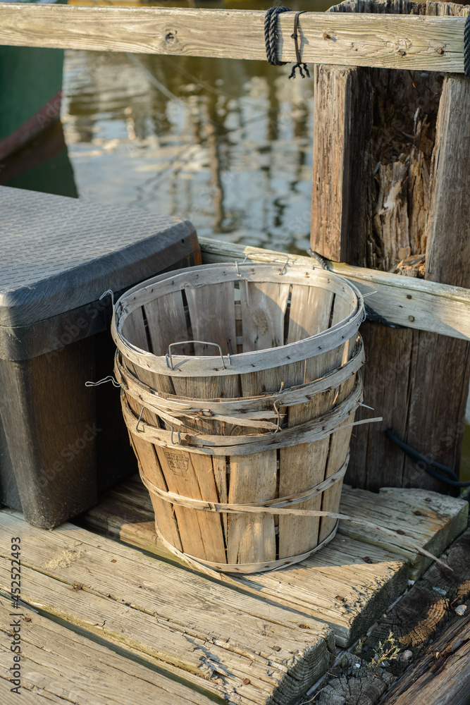 Old wooden peach buckets used for fishing as a storage containers for clams and crabs