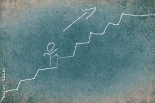 Stick figure walking up the stairs, chalkdrawing on a blue textured background photo