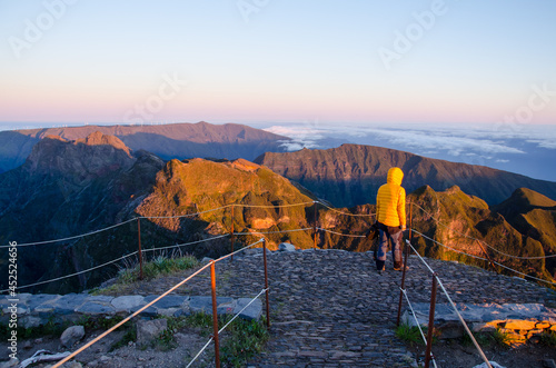 Tourist on the background of beautiful mountains. Pico Ruivo, Madeira. photo