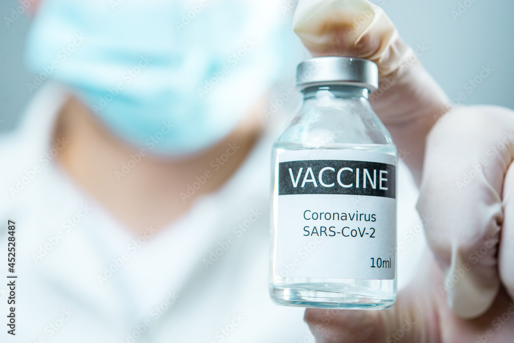 A little single glass bottle vial of new Covid-19 vaccine. Healthcare concept vaccination injection treatment. A little single glass bottle vial of new Covid-19 vaccine. Healthcare concept vaccination injection treatment.