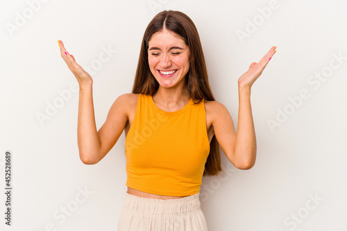 Young caucasian woman isolated on white background joyful laughing a lot. Happiness concept.