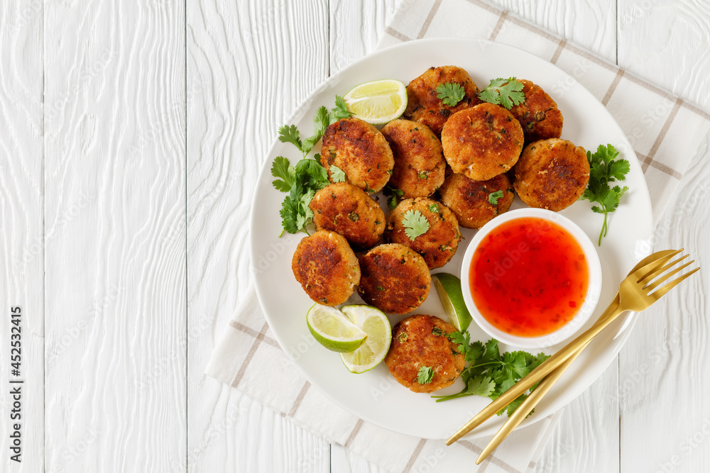 Tod man pla, thai fish cakes on a plate Tod man pla, thai fish cakes on a plate