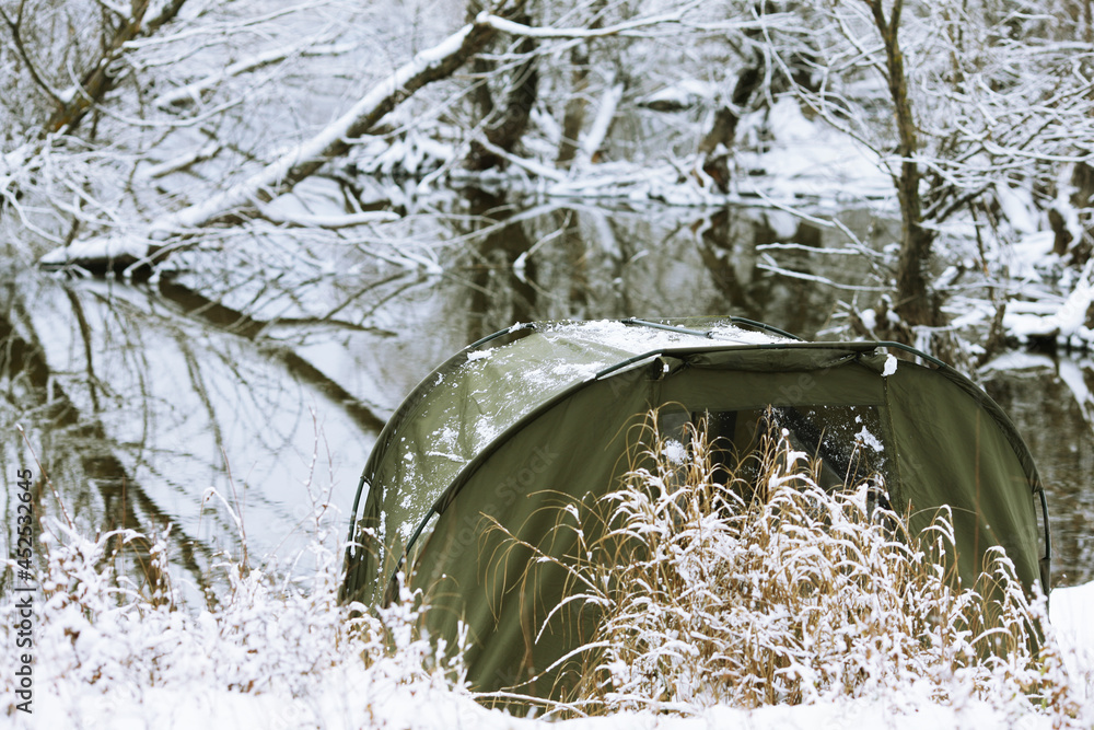 carp green tent in winter by the lake carp green tent in winter by the lake