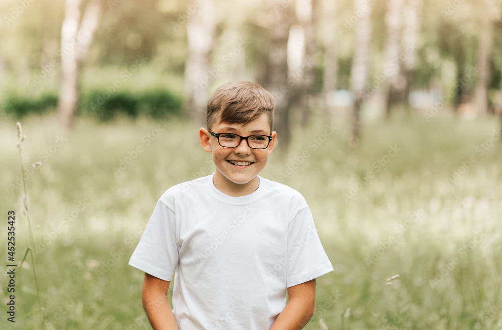 Portrait of a handsome boy with freckles and glasses Portrait of a handsome boy with freckles and glasses