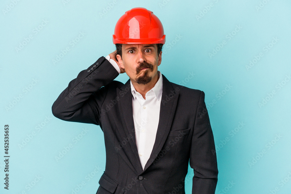 Young architect caucasian man isolated on blue background being shocked, she has remembered important meeting. Young architect caucasian man isolated on blue background being shocked, she has remembered important meeting.