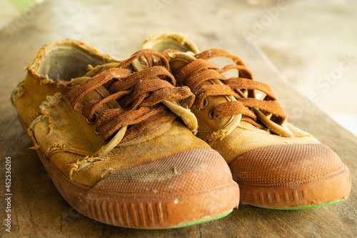 The front of an old student's shoe has been used for a very long time. Shoes of poor children living in the countryside