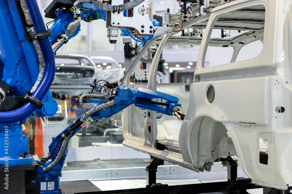 robot arm working in car factory robot arm working in car factory