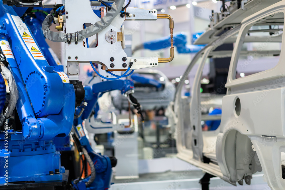 Fototapeta premium robot arm working in car factory