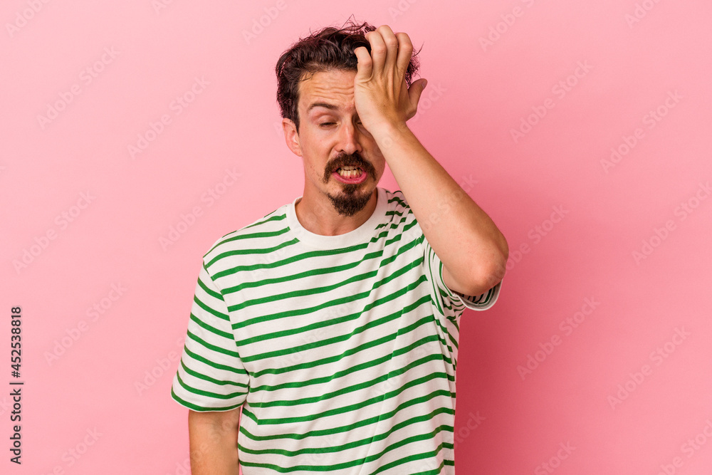 Young caucasian man isolated on pink background forgetting something, slapping forehead with palm and closing eyes. Young caucasian man isolated on pink background forgetting something, slapping forehead with palm and closing eyes.