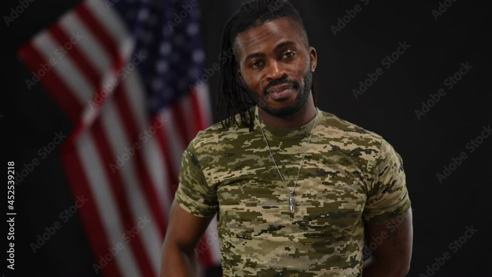 Portrait of brave handsome African American recruit saluting posing at ...