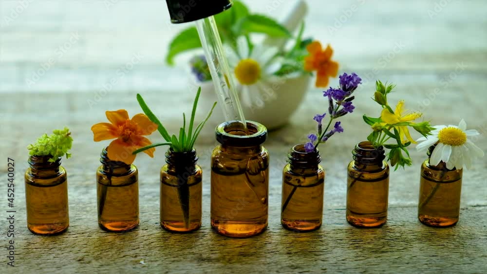 Tincture of medicinal herbs in small bottles. Selective focus. Tincture of medicinal herbs in small bottles. Selective focus.