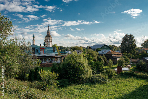 Summer Landscape of the city of Suzdal With a White Orthodox Church and wooden houses