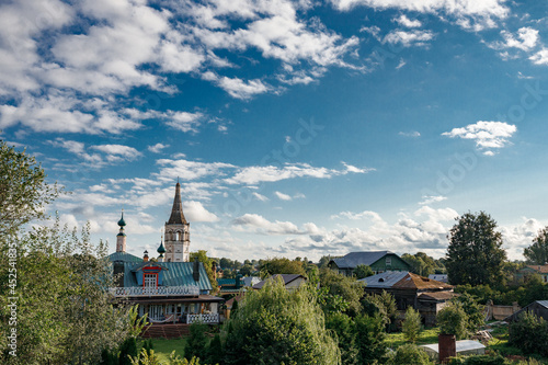 Summer Landscape of the city of Suzdal With a White Orthodox Church and wooden houses