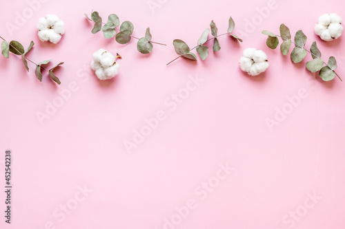 Floral flat lay pattern with eucalyptus leaves and cotton © 279photo