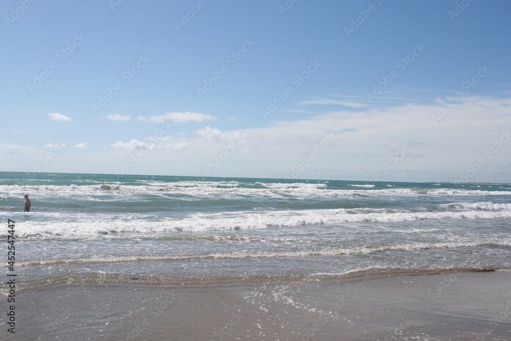 Sea coastline, sandy beach, waves