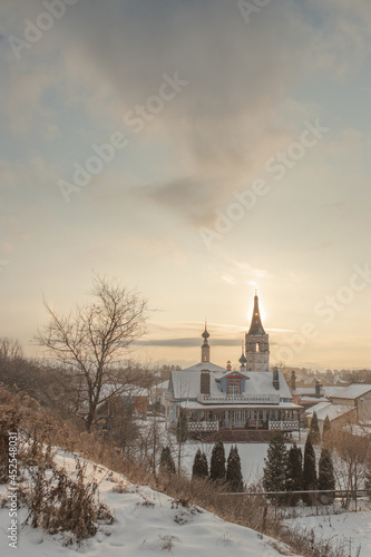 Suzdal, Russia. Winter landscape with an Orthodox church and wooden houses.