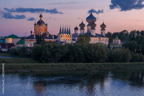 View of the domes of the Tikhvin Holy Assumption Monastery in August twilight. Leningrad region, Russia photo